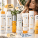 GK Hair product collection displayed on a bright salon vanity with a woman showing glossy brown hair. The image highlights salon results at home, sulfate-free care, color protection, frizz control, and nature-inspired hair care.