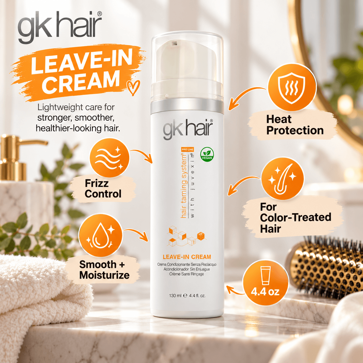 GK Hair Leave-In Cream displayed in a luxurious bathroom vanity scene. Orange graphic markers highlight frizz control, smoothing and moisturizing care, heat protection, suitability for color-treated hair, and 4.4 oz size.