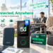 An advertisement image for the GlocalMe UPP 4G Pocket WiFi, shown as a black, rounded portable router in a scenic travel and work setting with a laptop, passport, airline tickets, and a coffee mug. The image lists key features of the product, including coverage in over 200 countries and regions, 1GB of global data for 90 days, no SIM card or contract requirement, connection for up to 8 devices, and access to 390+ carrier networks. Marketing text includes 'Global Internet In Your Pocket' and 'Work Anywhere'.