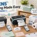 JADENS shipping workspace featuring two wireless thermal label printers, 4x6 shipping labels and label rolls on a home-office desk, highlighting wireless printing, inkless operation and small-business fulfillment.