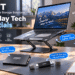 JOIOT tech essentials displayed in a modern workspace, featuring an adjustable laptop stand, 2.5-inch SSD, dual-interface USB flash drive, and magnetic portable SSD attached to a phone. English callouts such as “Everyday Tech Essentials” and “Work, Save, Go” highlight portable storage and everyday productivity.
