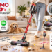 MOHOMO Nova V5 cordless vacuum cleaning a hardwood floor in a bright modern living room with a pet dog nearby, highlighting 650W power, 55KPa suction, up to 70-minute runtime, OLED touch screen, anti-tangle brush, and self-standing design.