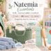 Natemia Essentials brand showcase featuring a happy baby in a green hooded bath wrap, an organized rope diaper caddy, a set of stacked washcloths, a baby wooden hair brush set, and a crib with muslin blankets and bedding, highlighting "Soft, Sustainable Comfort" for bath, nursery, and bedtime. Text overlays explain benefits like "Cozy After Bath," "Gentle Everyday Care," and "Natural Care for Growing Hair."
