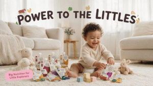 A wide shot of a smiling baby with curly hair sitting on a shaggy rug in a living room, surrounded by multiple Serenity Kids baby food pouches of different flavors like Beef, Chicken, and Bison, and several plush lamb and rabbit toys. Across the top, the text "POWER TO THE LITTLES" is written with small animal illustrations. A pink text box in the bottom left corner reads "Big Nutrition for Little Explorers".