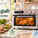 VAL CUCINA stainless steel air fryer toaster oven in a bright modern kitchen, shown roasting chicken with pizza, grilled steak and vegetables nearby. Graphic callouts highlight infrared heating, 10-in-1 versatility, family-size capacity and countertop convenience.