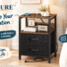 Yoobure rustic brown nightstand with charging station beside a cozy bed in a bright modern-rustic bedroom, promotional hero image with callouts “Power Up Your Relaxation,” 2 USB ports, 2 outlets, open shelf and two fabric drawers.