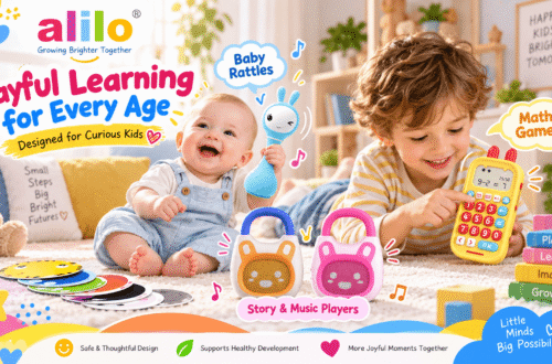 Promotional poster for the alilo brand with the main title "Playful Learning for Every Age" and subtitle "Designed for Curious Kids". The brand logo is at the top left. The image features two children on a carpet. A cute baby (approx. 0-1 year) in blue overalls sits on the left playing with a collection of colorful, round, animal-faced learning cards, with a "Baby Rattles" label pointing to a blue Smarty Bunny rattle. Beside him sits a slightly older boy (approx. 3-5 years) operating a yellow, rabbit-shaped number machine with a "Math Games" label pointing to it. Three books with inspirational text are next to the boy. Between the children, orange and pink Story & Music Players are shown with a label. The footer lists brand benefits: "Safe & Thoughtful Design", "Supports Healthy Development", "More Joyful Moments Together". A "Little Minds Big Possibilities" bubble is at the bottom right.