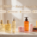 NUXE Paris official Amazon store blog promotional banner, full natural French skincare product collection displayed on warm beige marble bathroom counter, golden morning sunlight, cozy authentic home use scene, cute hand-drawn cartoon English callout labels, clean premium commercial beauty photography, 16:9 wide format