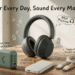 EN: Clemm lifestyle blog header showing a bright home-office desk with the dark gray Clemm Preset wireless over-ear headphones worn by a person, alongside the sage green Core 100 GaN wall charger, off-white Source 10,000 mAh power bank, and light sage braided USB-C to USB-C Chain cable, with playful cartoon doodles and English callouts "Power Every Day, Sound Every Moment."