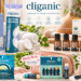 Cliganic clean beauty and wellness collection featuring cotton rounds, essential oils, mosquito repellent bracelets, organic lip balms, facial cleanser, and nail files in stylish everyday lifestyle settings with colorful illustrated annotations.
