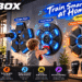 LOLBOX music boxing machines in a modern home gym, featuring three LED-lit models. Adults and a child practice boxing with Bluetooth music, colorful fitness annotations, and dynamic graphic elements.