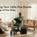 Mamazing baby essentials collection — stroller, nursing chair, crib, mattress, high chair, and stroller fan staged in a sunlit family nursery scene with mom and baby.