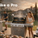 A wide promotional blog banner for Monument Grills: three stainless steel gas grills in a golden-hour backyard BBQ party scene — a tall 4-burner cart grill on the left, a 5-burner cabinet grill with glass window in the center, and a compact tabletop 2-burner grill on the right. Western adults grill burgers under glowing string lights; headline "Grill Like a Pro" and tagline "Monument Grills — Built for Backyards, Campsites & Every Meal in Between", accented with cartoon flame and burger stickers.