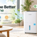 Waykar white dehumidifier in a bright modern living room, featuring smart moisture control, fresh-air graphics, green plants, and the promotional headline “Breathe Better at Home.”