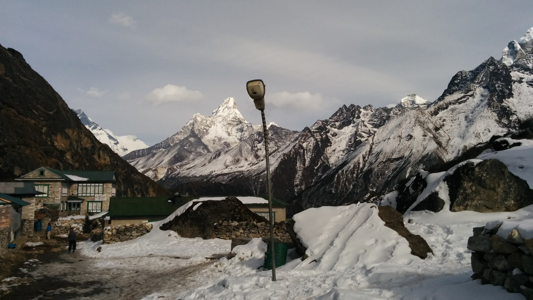 A lamp post in Khumjung, with Ama Dablam on the backdrop