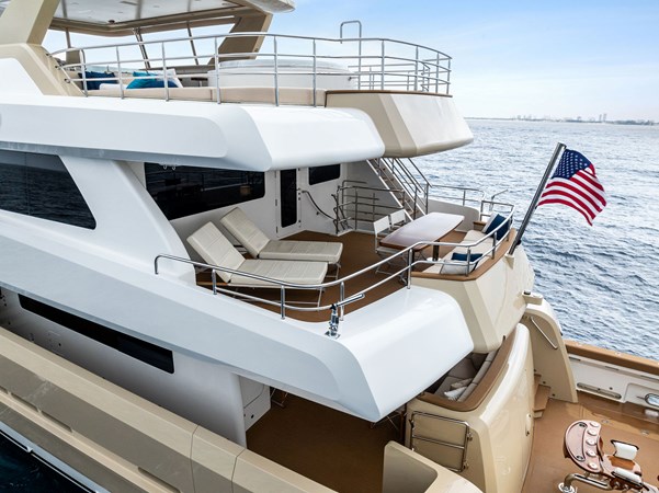 Bridge Afterdeck with chaise loungers, aft settee, table