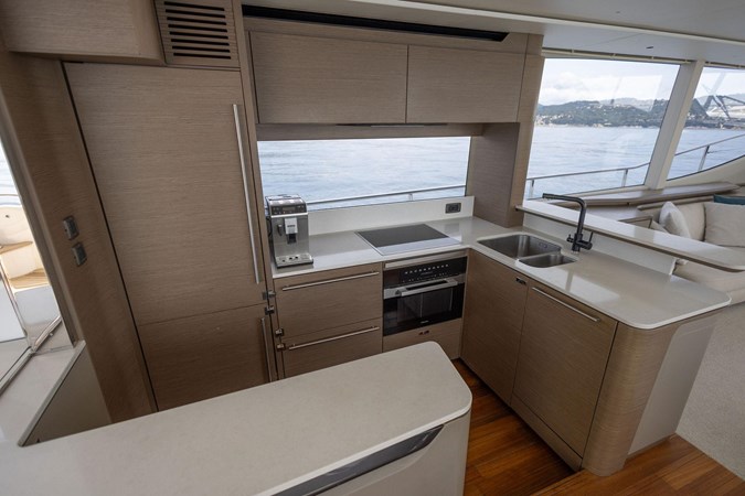 Luxury Princess Y72 yacht cruising on open sea, 2021 model.