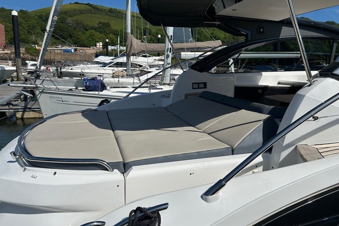 2017 Princess V48 Open yacht docked at marina under clear blue sky.