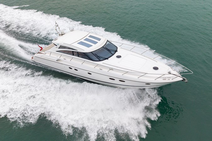2009 Princess V58 yacht cruising on calm waters, side view.