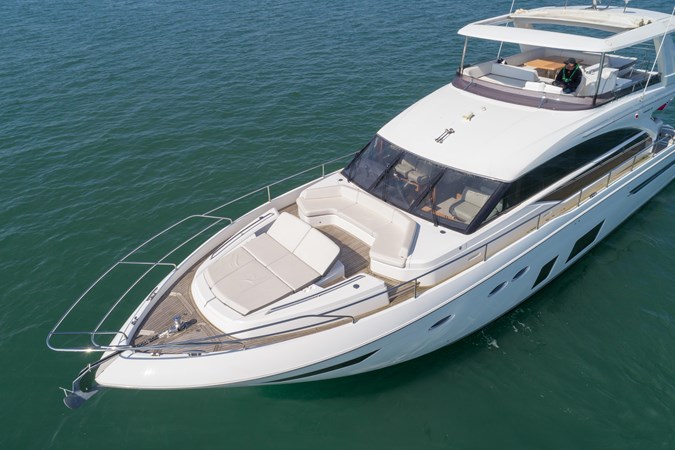 2016 Princess 68 luxury yacht cruising on the water.