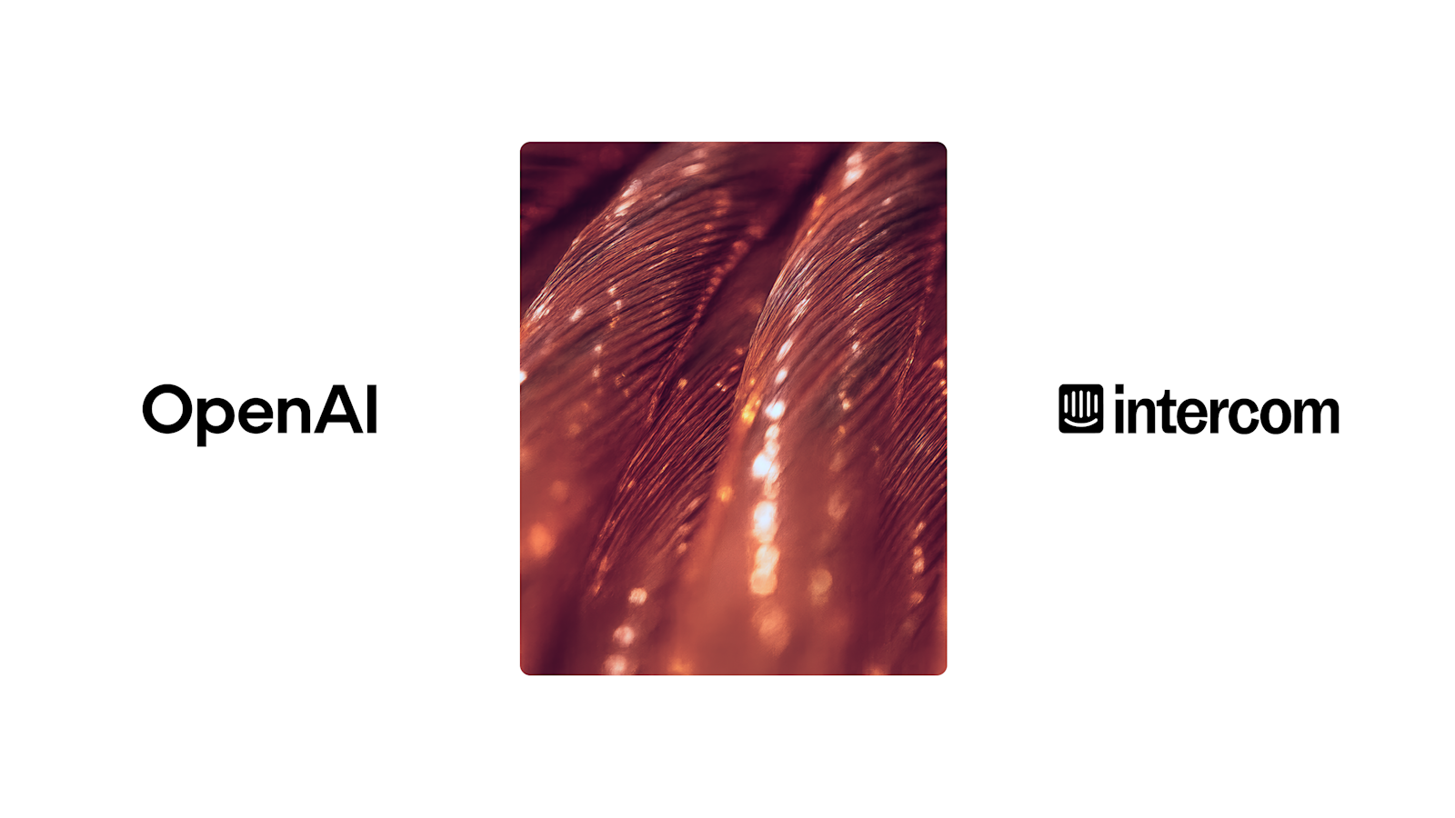 Close-up of copper wire strands with glowing reflections, overlaid with the white Intercom logo centered in the frame.