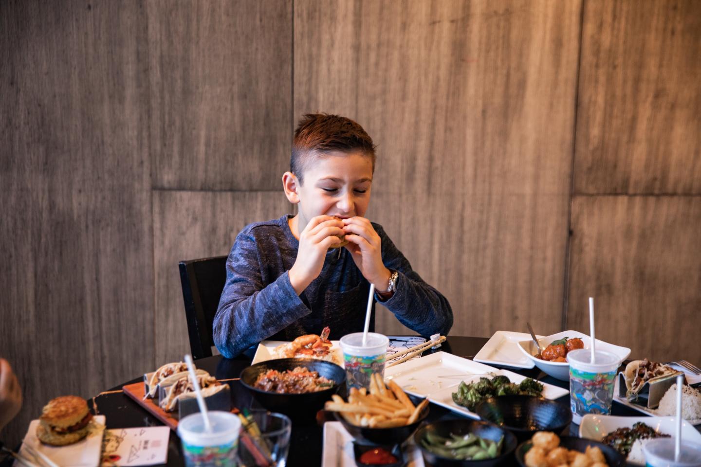 Child eating from Tokio Pub's new kids' dinner menu