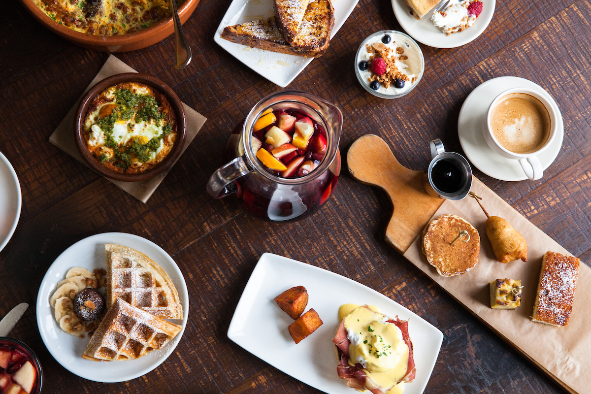 overhead photo of brunch tapas and a pitcher of sangria