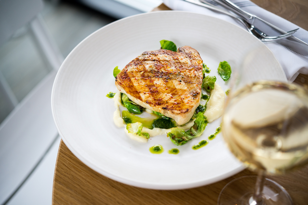 Grilled fish with a glass of white wine