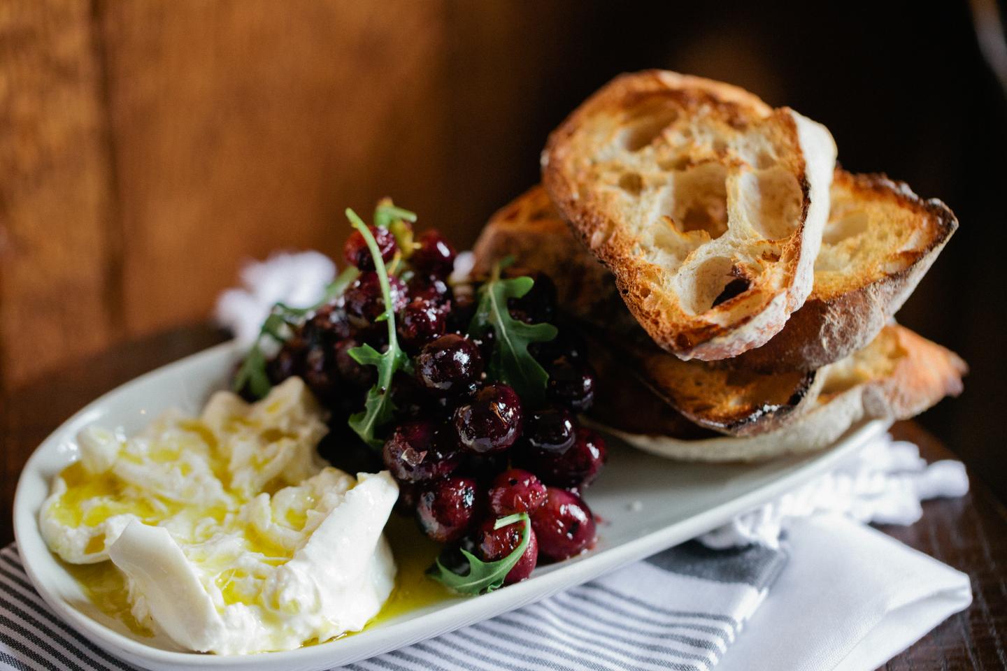 burrata and grilled grapes with bread from stella barra