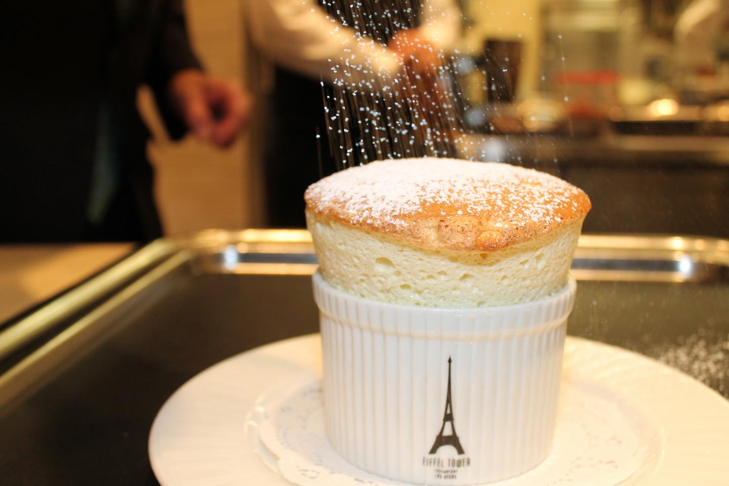 Eiffel Tower Souffle Sprinkling Powdered Sugar