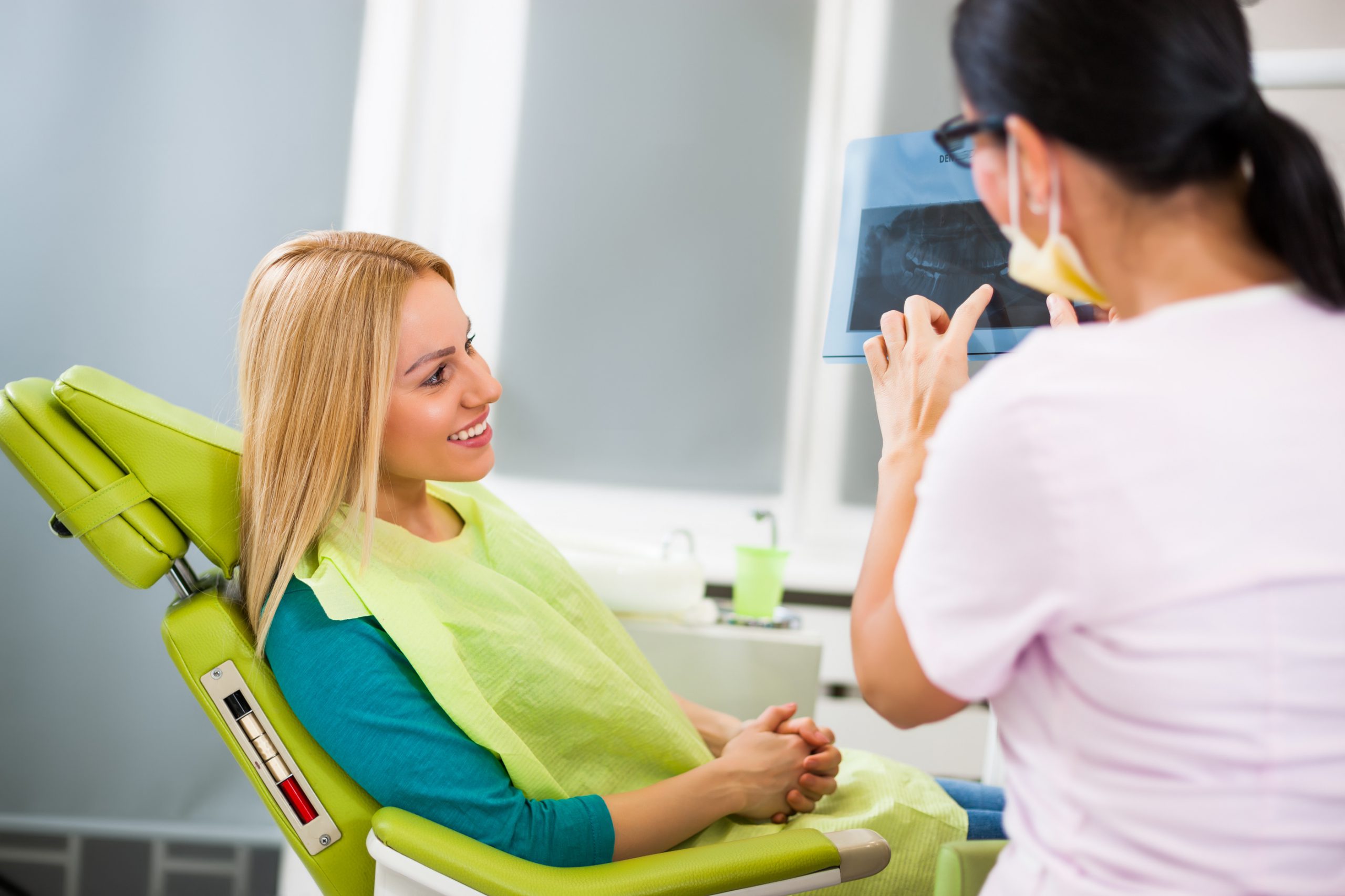 Woman at dentist office getting an examination.