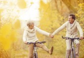 Healthy older couple, active, biking