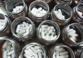 capsule vitamins in bottles during manufacturing