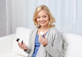woman choosing between vitamins