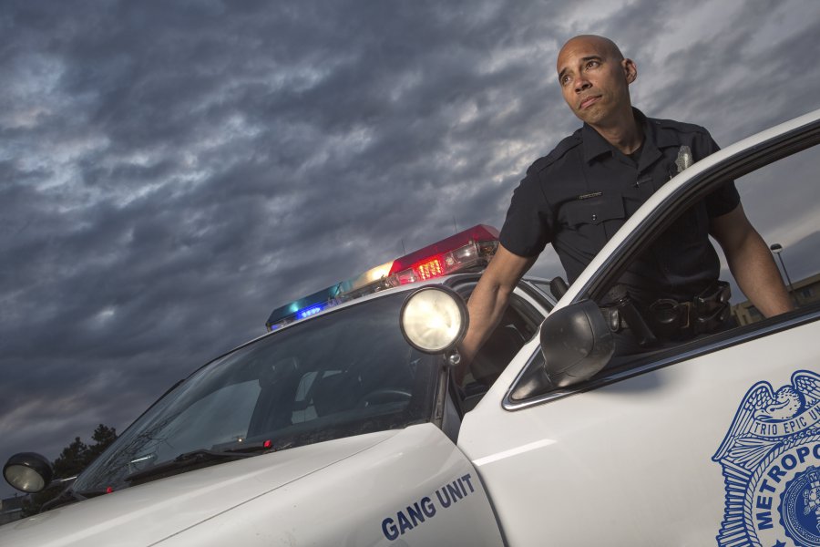EMERGENCY SERVICES - Gang Unit Police Officer getting out of vehicle