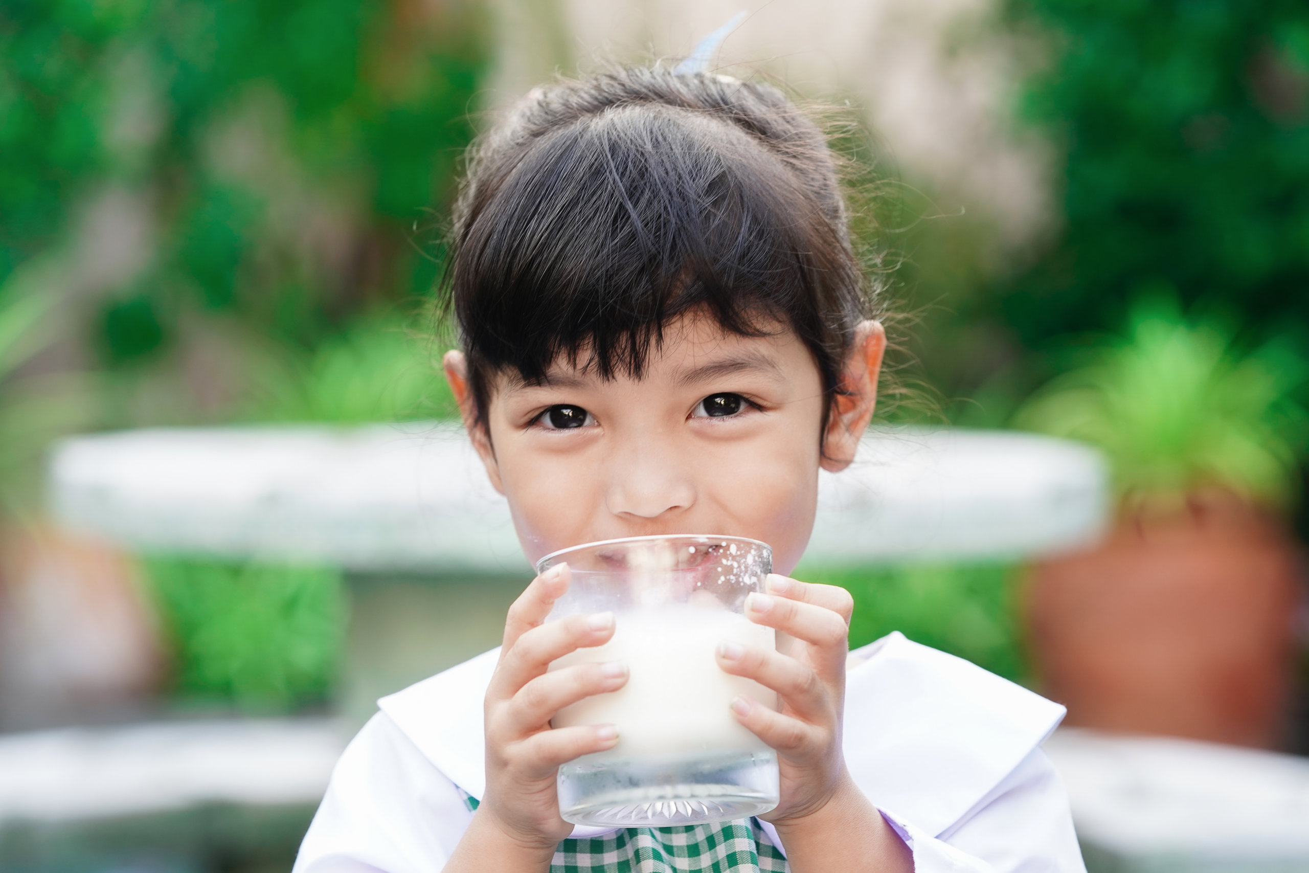 Young girl drinking milk