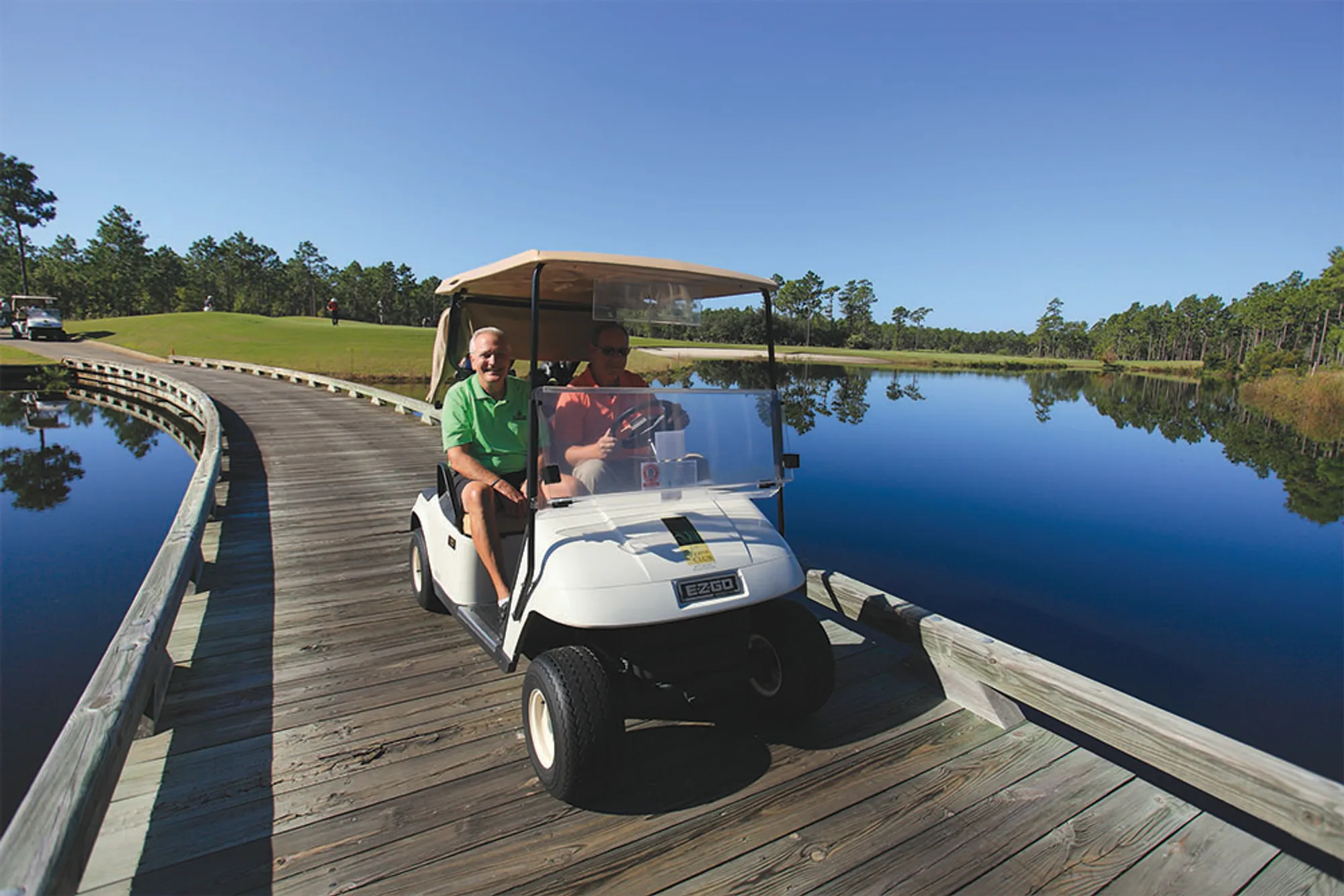 Two men golfing at a scenic course in North Carolina