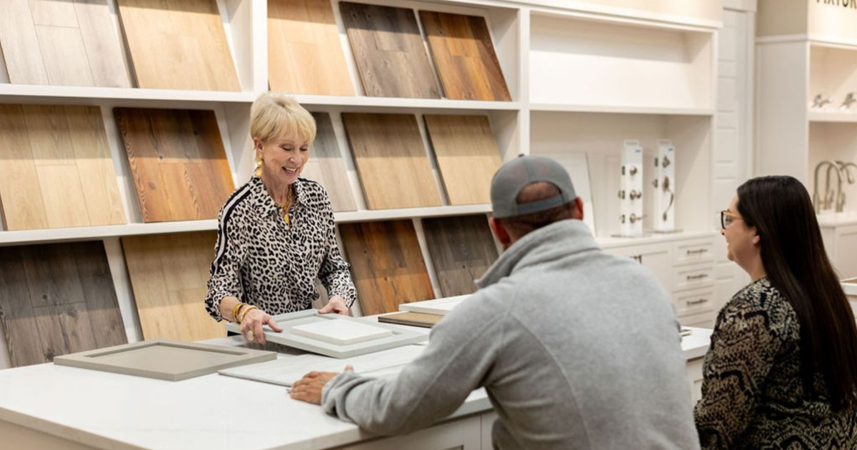 Smith Family Homes' in house designer Susan Brinkley going through cabinet options with homebuyers.