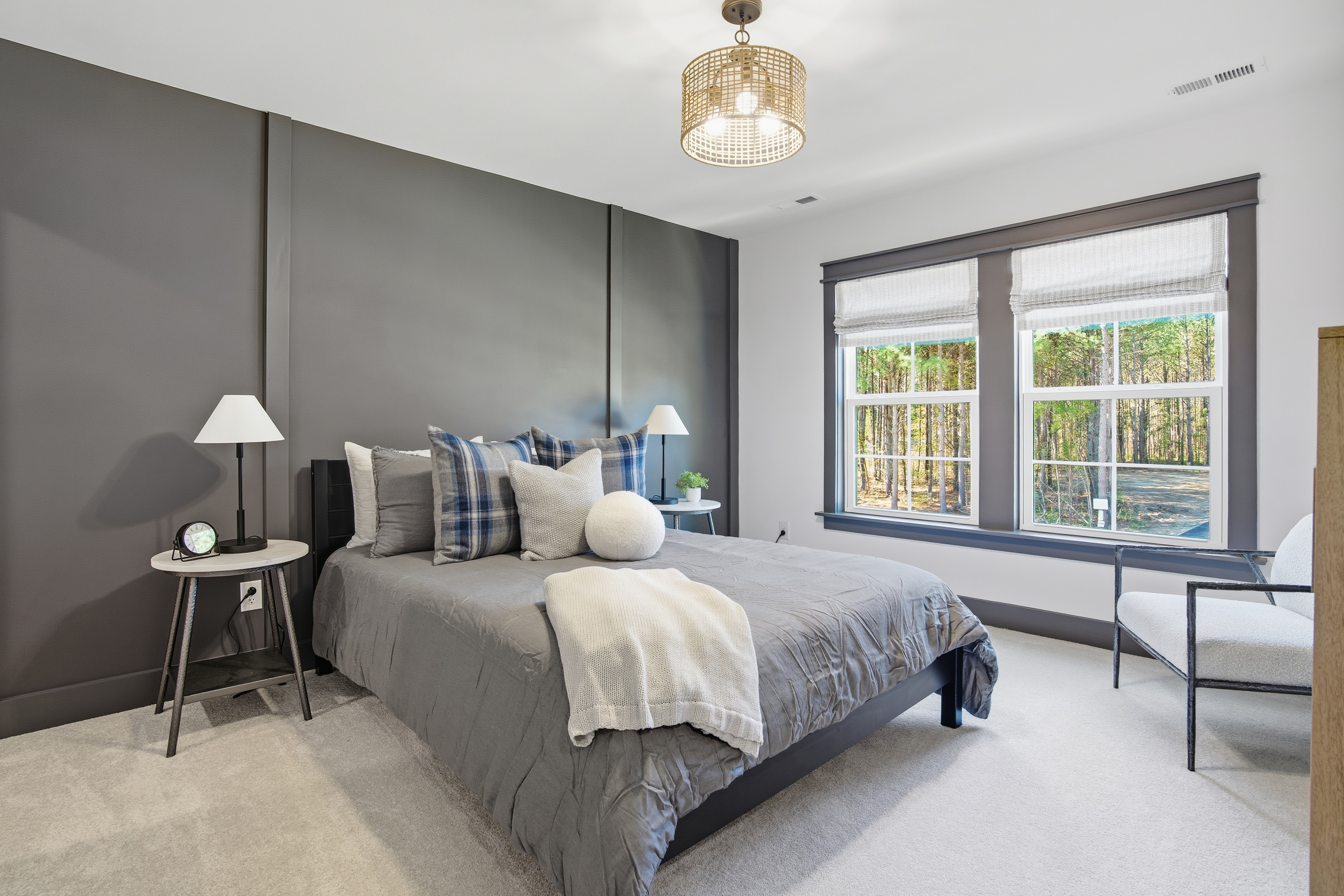 A view from the bedroom in the Appomattox plan from StyleCraft Homes. There are trees in the background outside the window.