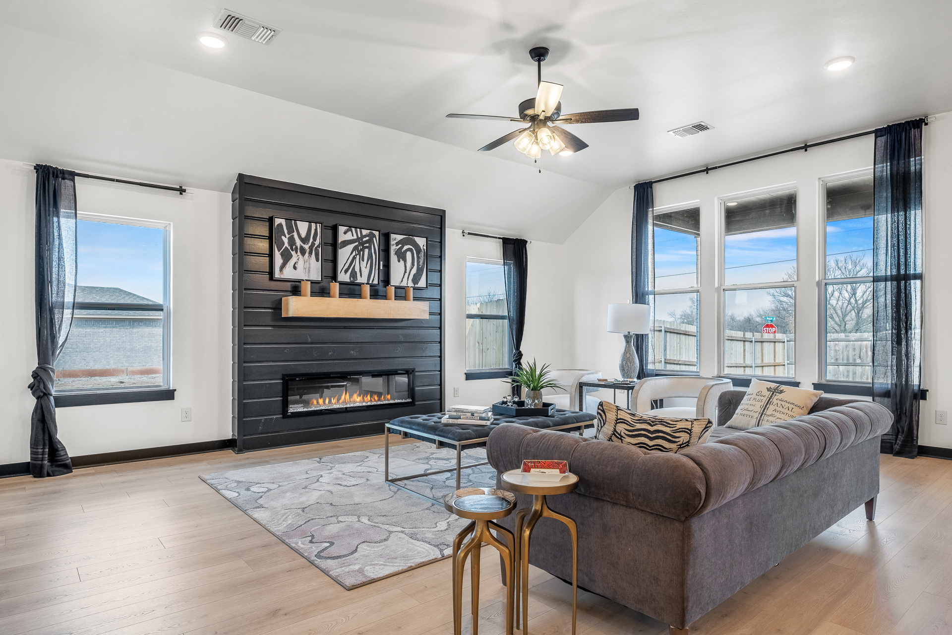 Modern Farmhouse Model Home (Stillwater, OK); Living Room with Black Shiplap Fireplace and Stained Mantle