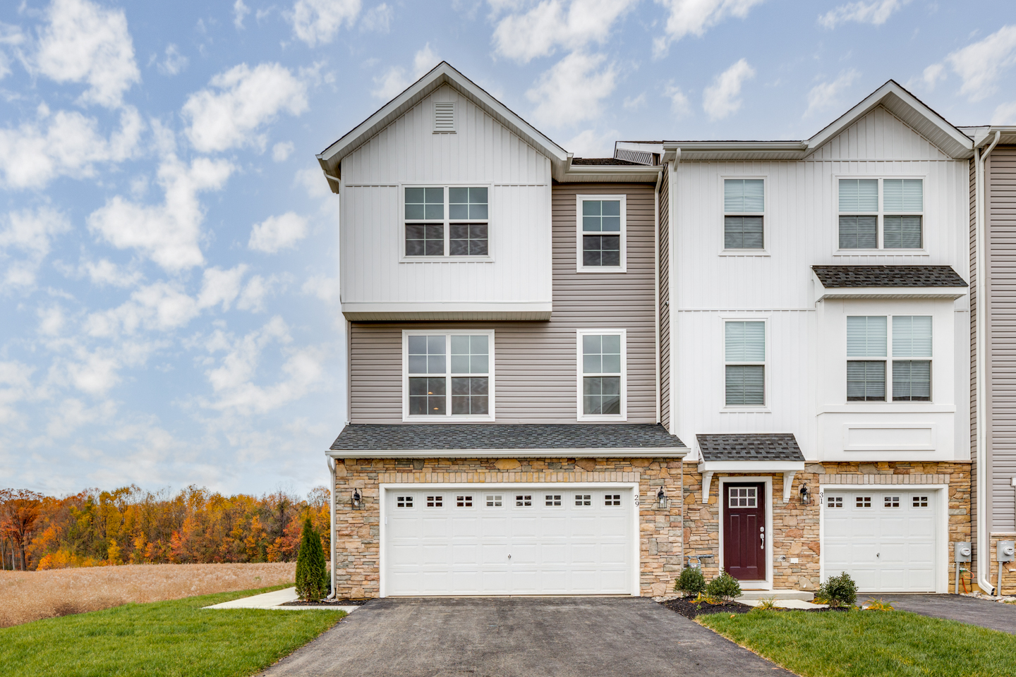 Front of an end-unit townhome with a two-car garage