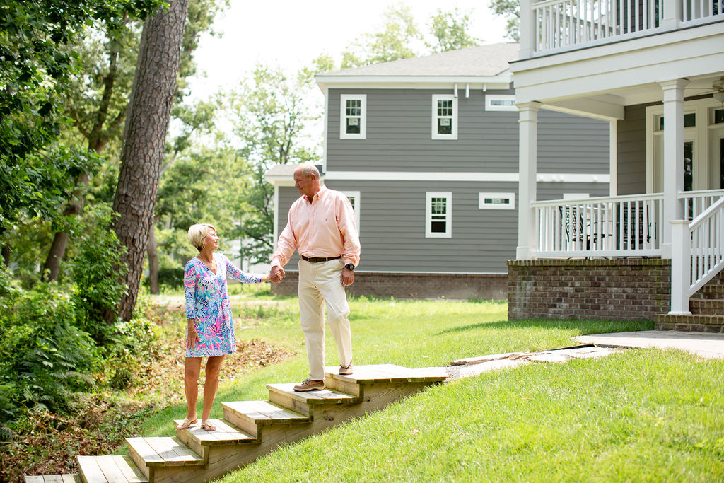 Retired couple outside their home in Virginia Beach