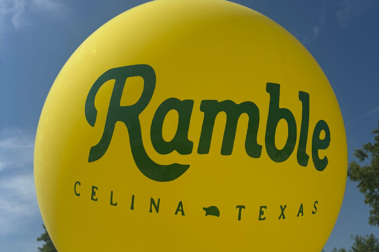 Large balloon reading "Ramble" and "Celina, TX"
