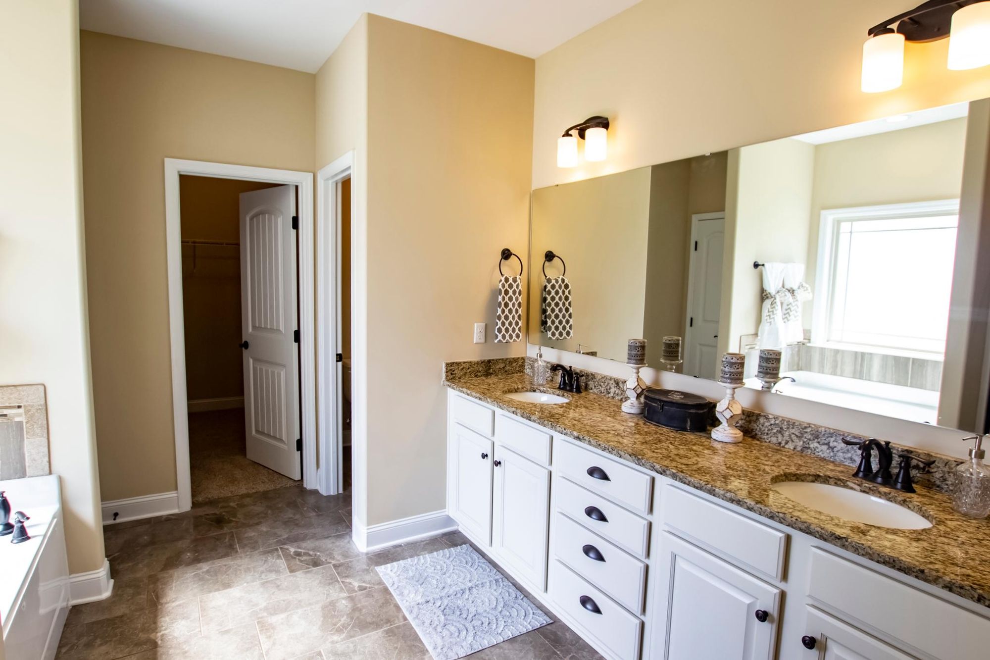 Bathroom with multiple sinks in hyde home