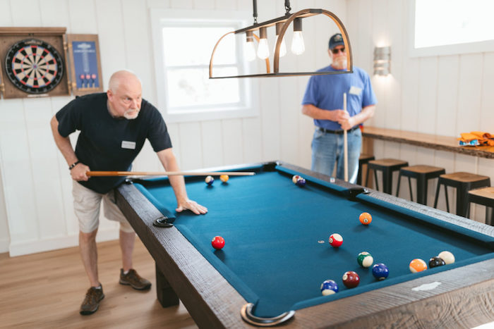 Men playing pool.