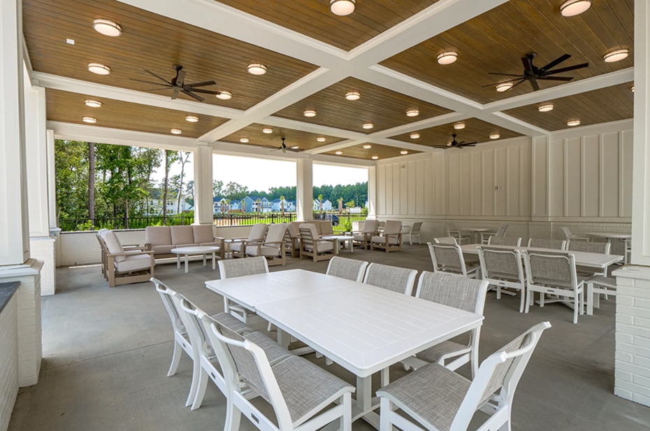 Pool seating area in the Grand Park community.