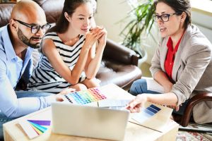Couple and Home Designer Going Over New Home Options - NTH Blog 