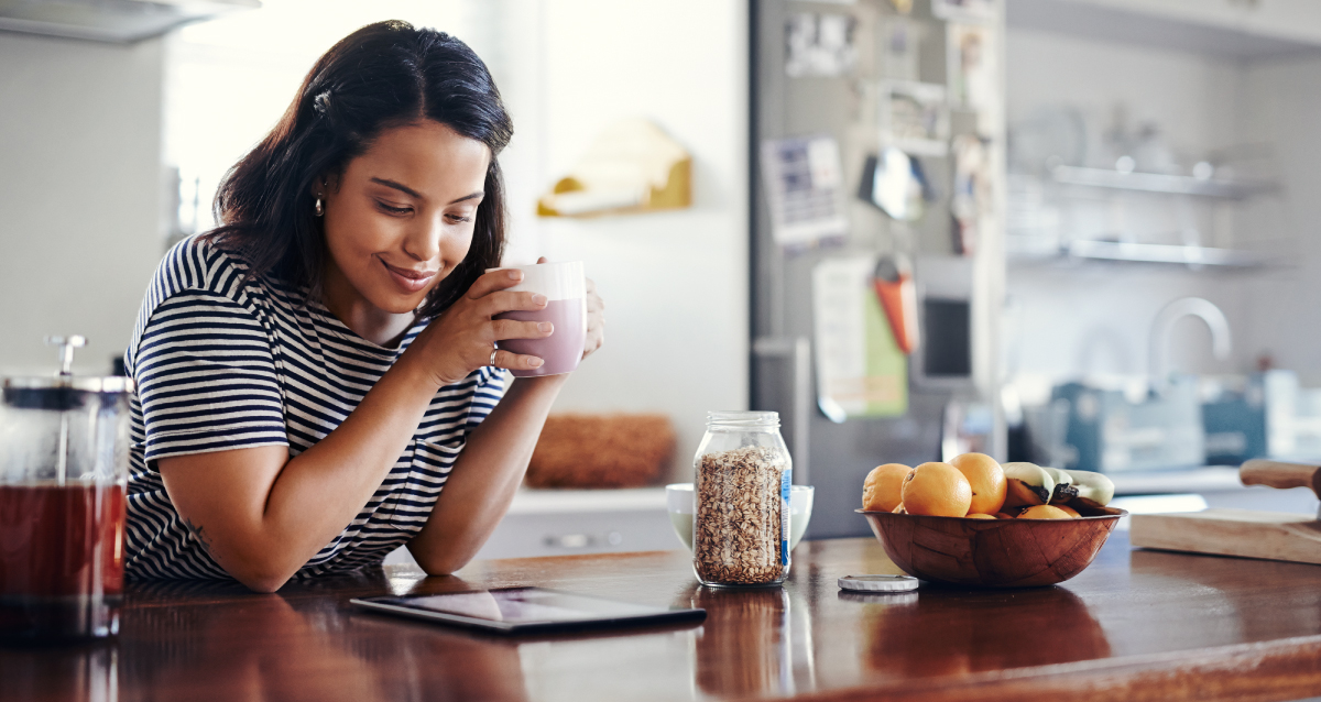 Woman brainstorming new year's resolutions in her McGuinn kitchen.