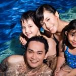 Happy family in pool of a Weston Dean Custom Home