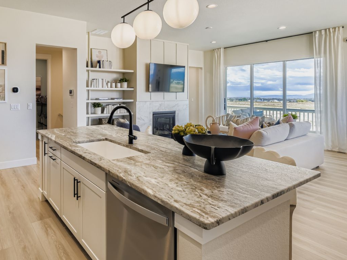 Gorgeous marbled granite kitchen island overlooking bright living room